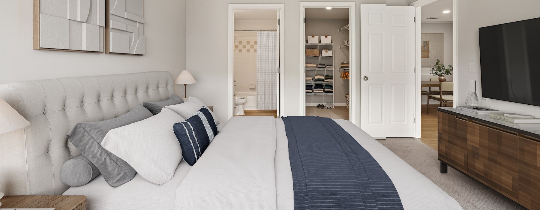 a bedroom with a bed and a tv