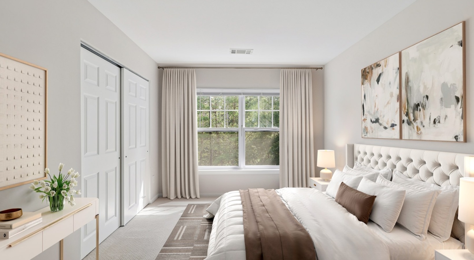 a bedroom with a bed and a table